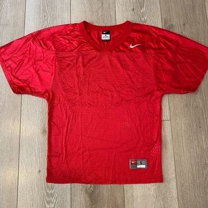 Boys red Nike football practice jersey